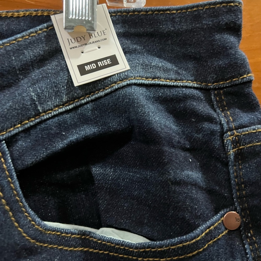 New mid rise dark wash jeans